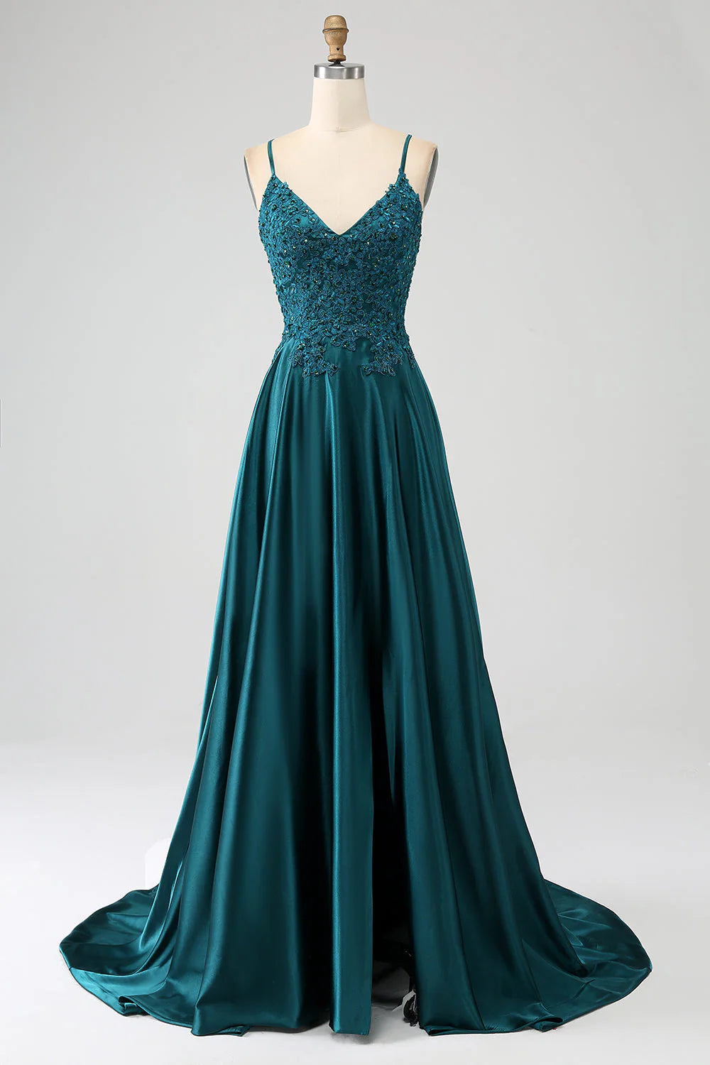 A-line spaghetti strap prom dress in peacock green with a side slit.