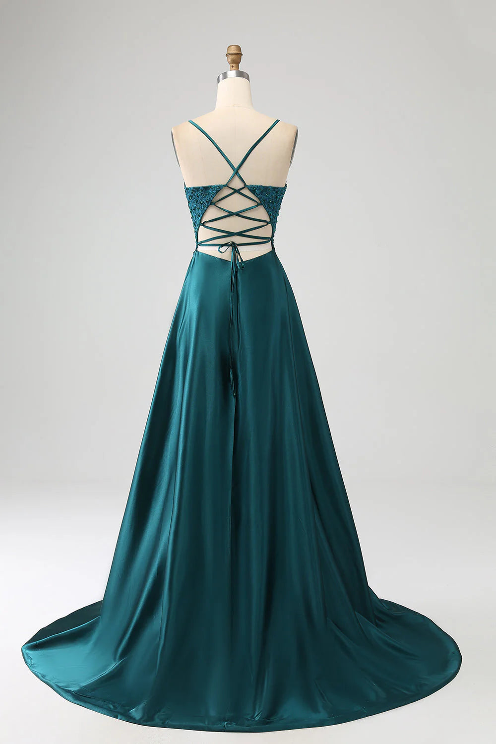 Back view of the peacock green A-line prom dress with spaghetti straps.