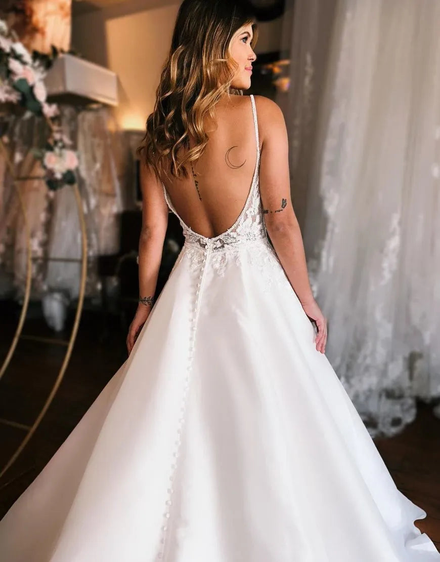 Back view of A-Line Spaghetti Straps Wedding Dress with open design.