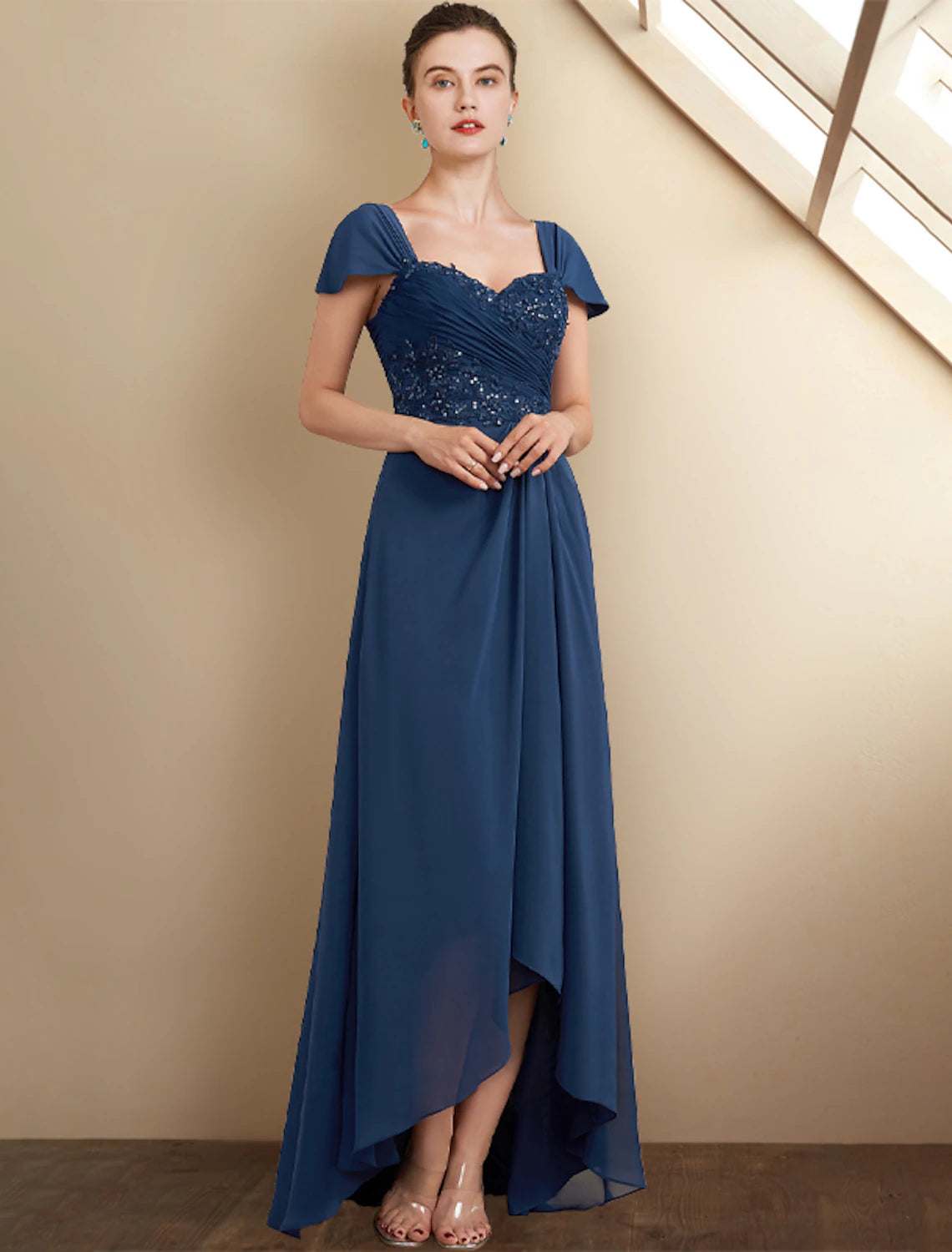 Back view of the A-Line high-low tea length dress, showcasing chiffon flow.