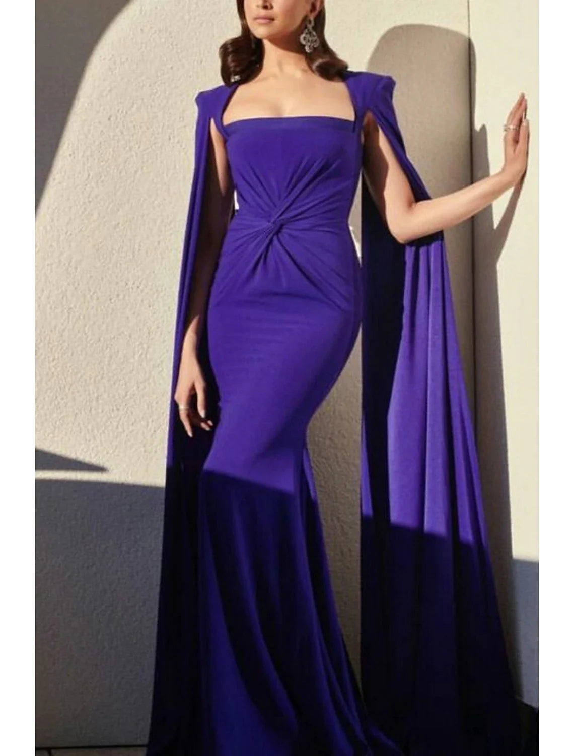 Woman posing in the A-line formal gown, emphasizing the pleats and stretch fabric.