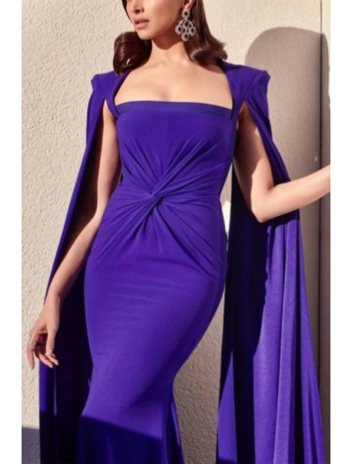 Detailed view of the fabric and pleating on the A-line square neck dress.