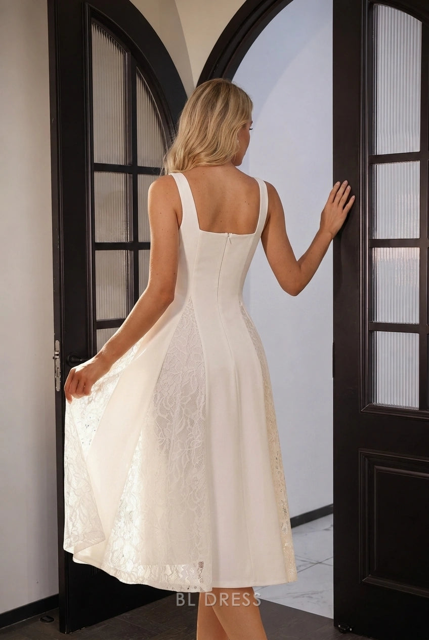 Back view of the white A-line midi dress, highlighting the lace paneling.