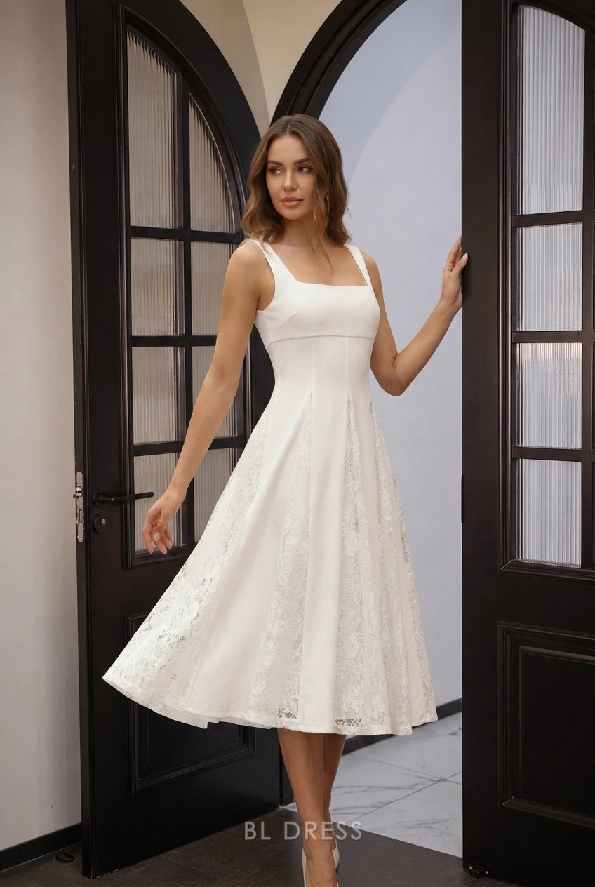 Close-up of the delicate lace detail on the white A-line prom dress.