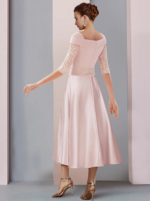 Back view of a tea length Mother of the Bride dress with square neckline.