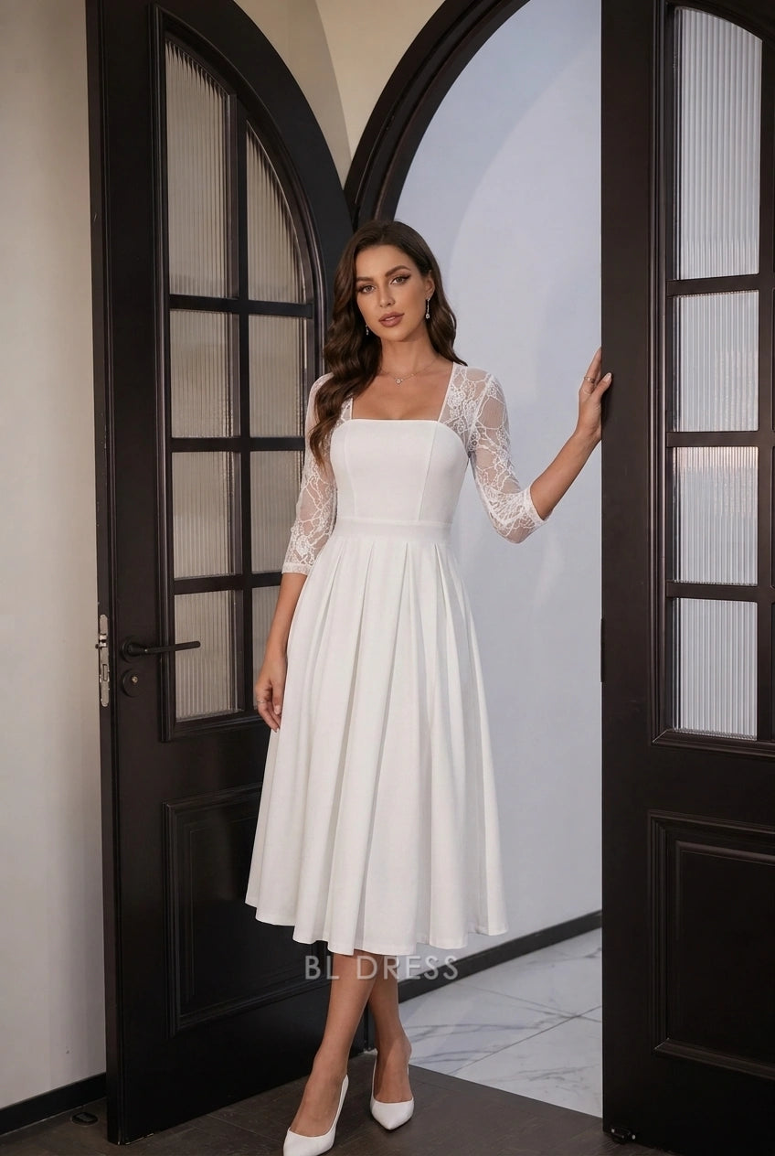 Back view of white A-line midi dress with flowing pleated skirt.