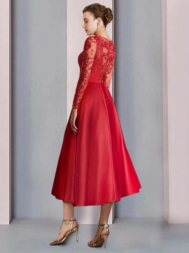Side view of the tea-length A-line dress with long sleeves.