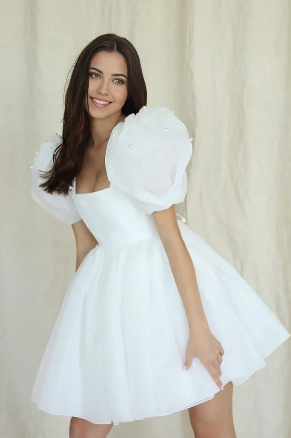 A-line square-neck short wedding dress with puffy pearl sleeves.