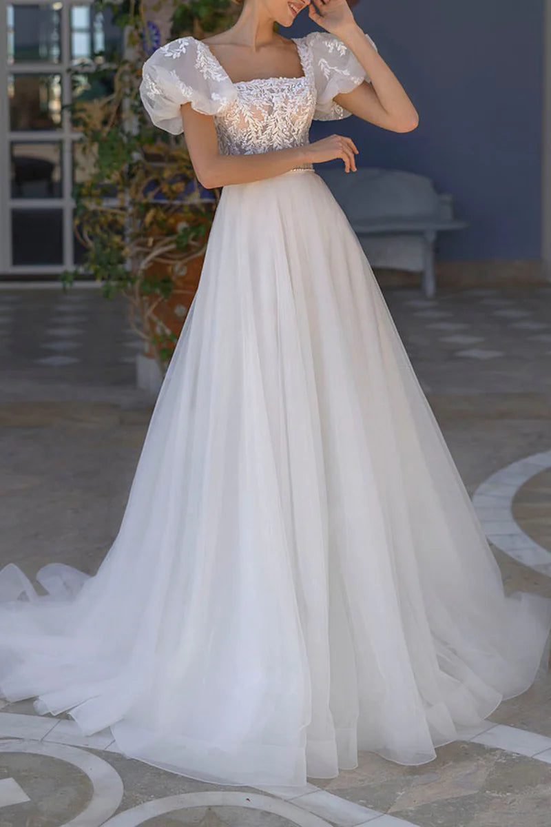 Elegant A-line wedding dress with square neckline and short sleeves, adorned with lace appliques.