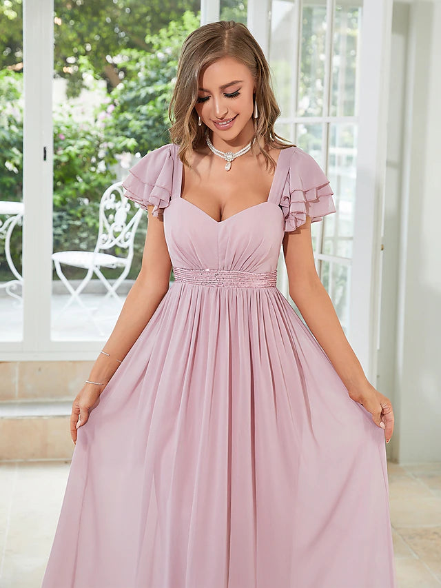 Back view of A-line floor-length dress with ruffles.