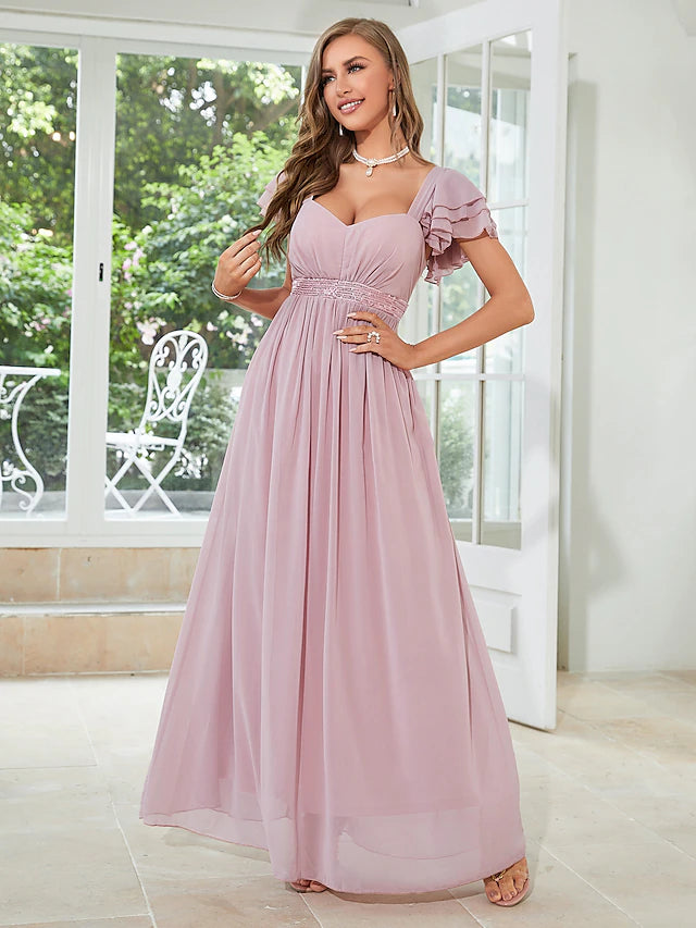 Close-up of square neckline and ruffled short sleeve on chiffon dress.