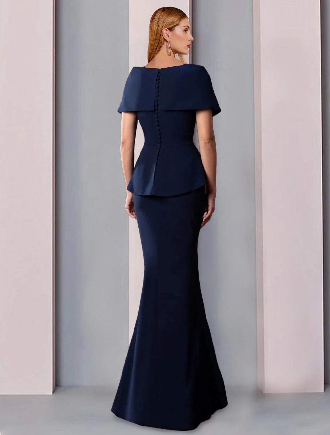 Back view of a floor-length formal gown, showing the A-line silhouette.