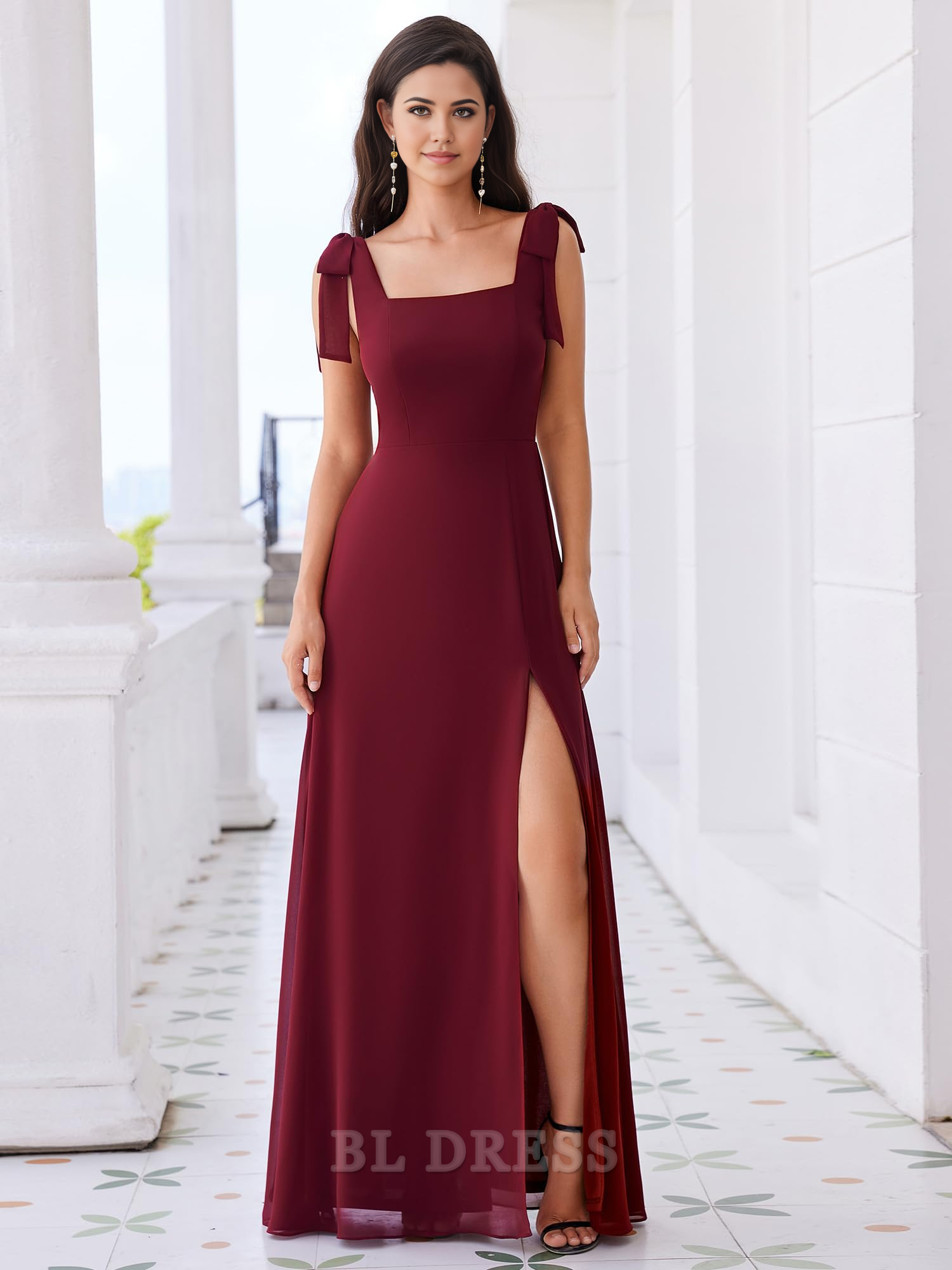 Close-up of the square neckline and sleeveless design of a formal gown.
