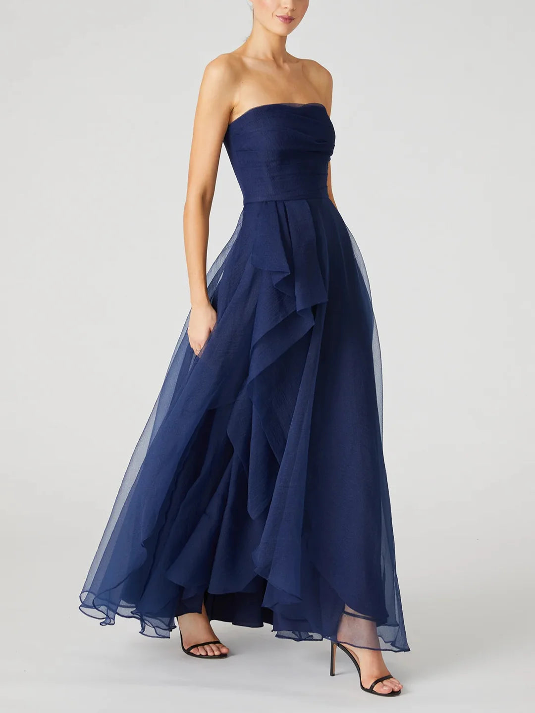 Back view of a navy ankle-length strapless dress.