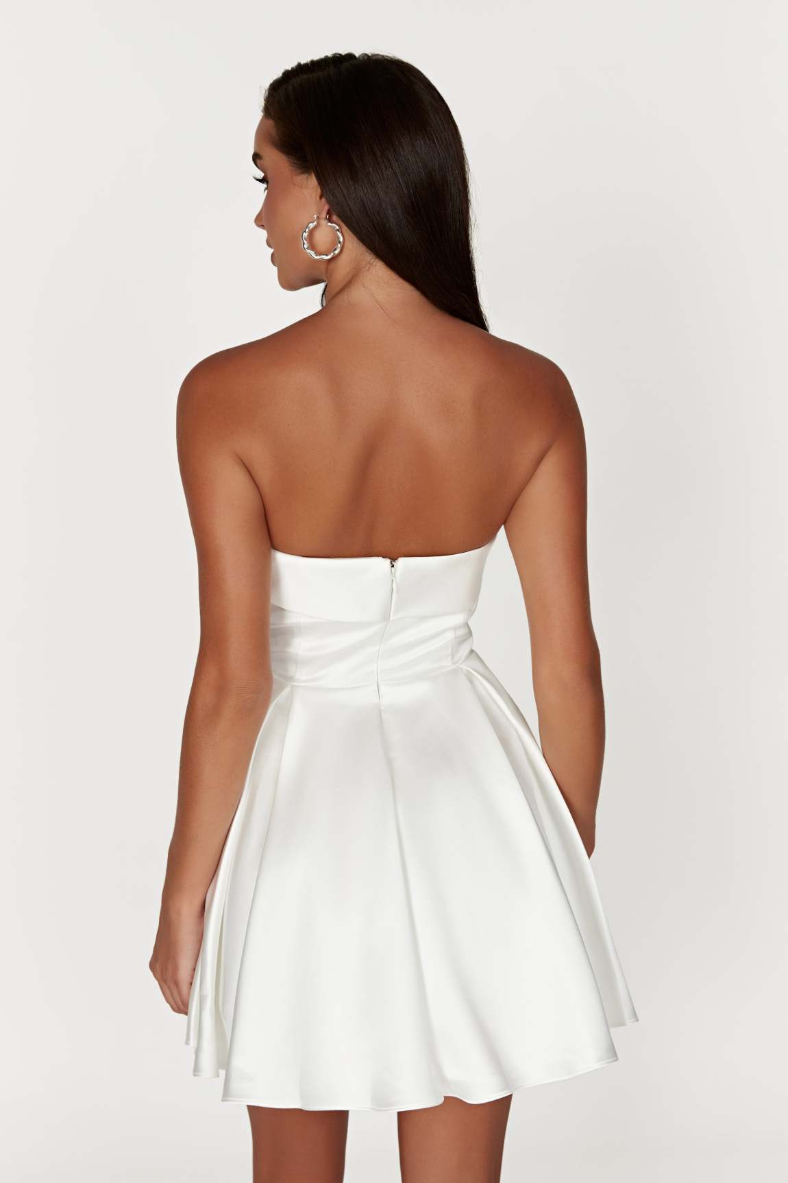 Back view of the elegant strapless mini homecoming dress.