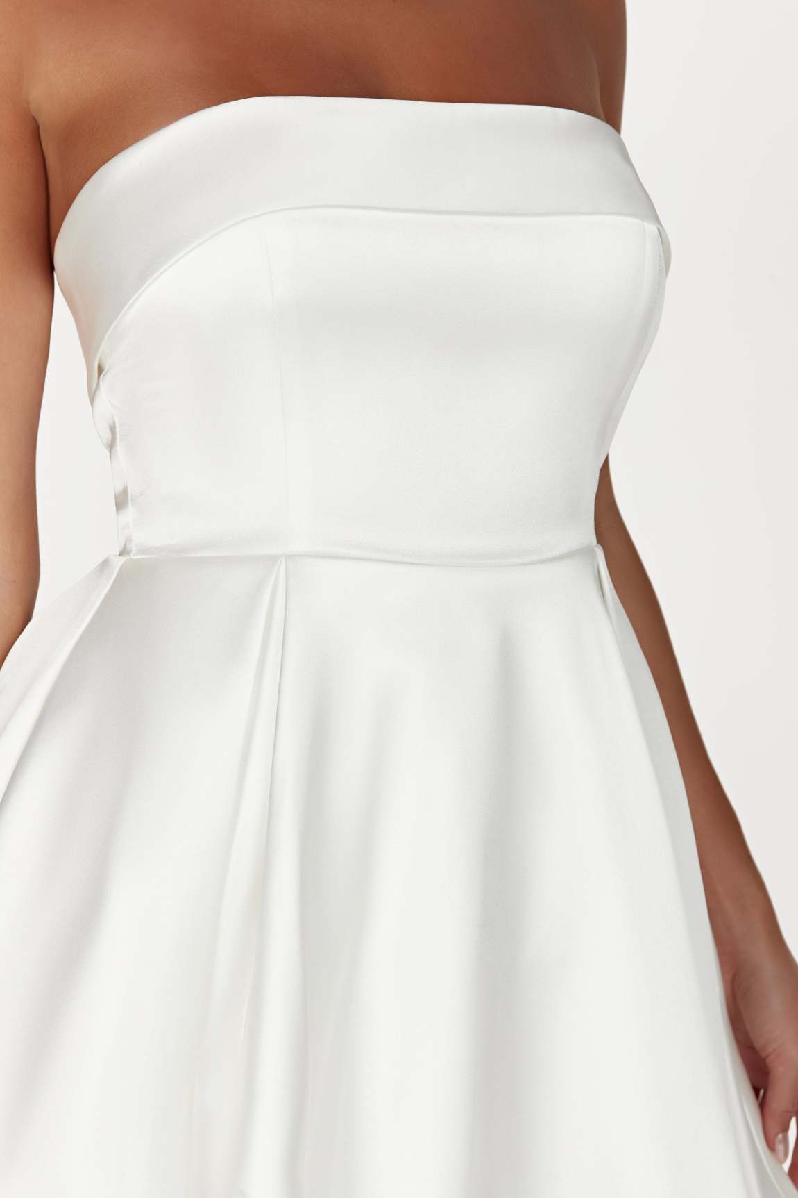 Side view of the elegant strapless backless mini dress.