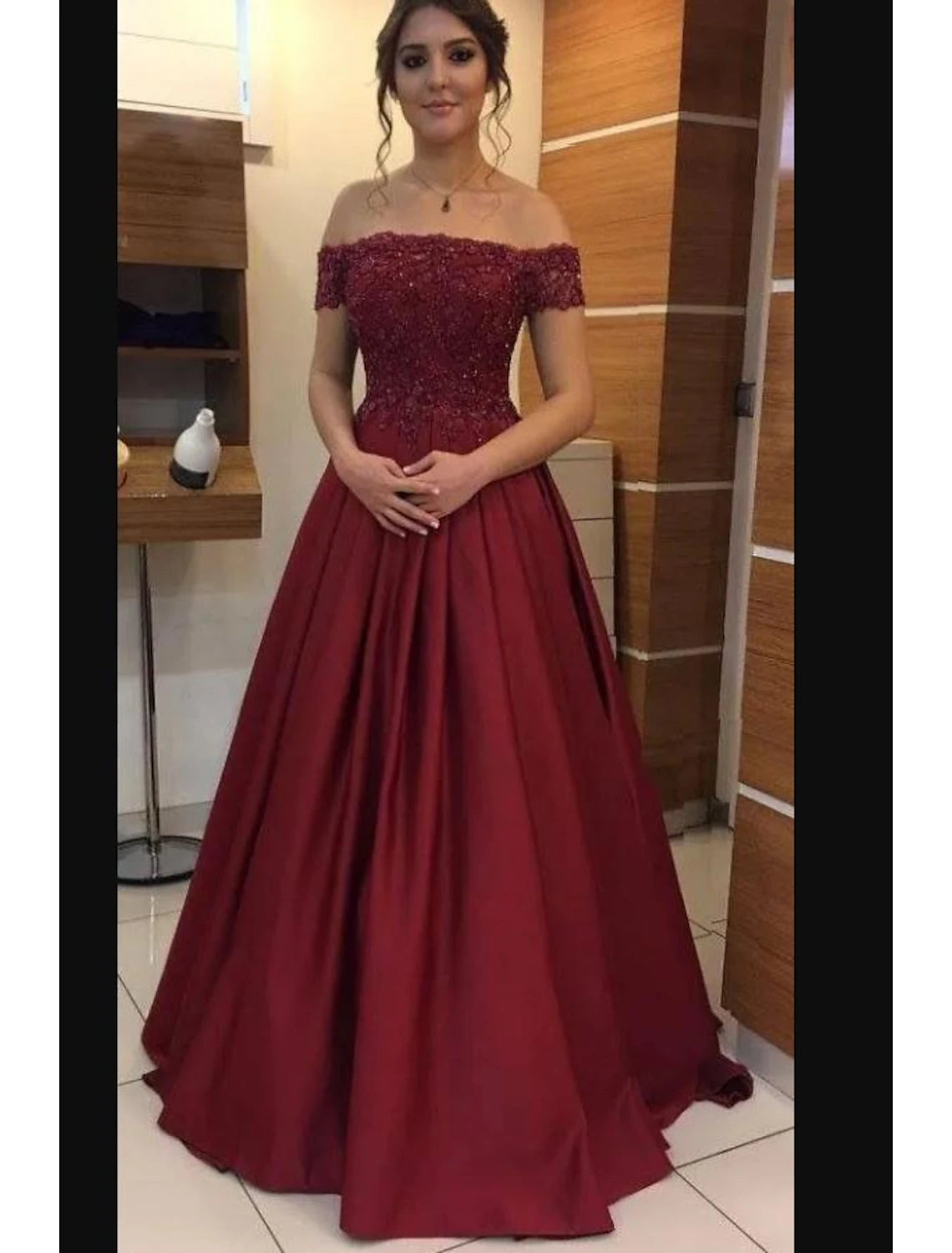 Elegant A-line strapless evening gown with beading appliques and a floor-length silhouette.