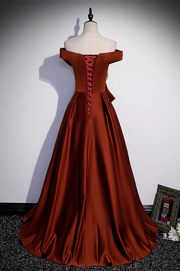 Back view of A-line formal dress showing lace-up closure and bow detail.