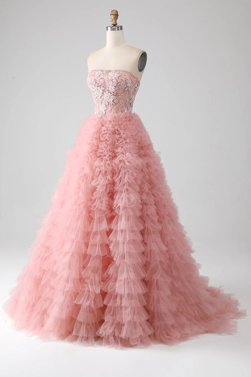 Side view of the A-Line strapless beaded tiered blush long prom dress.