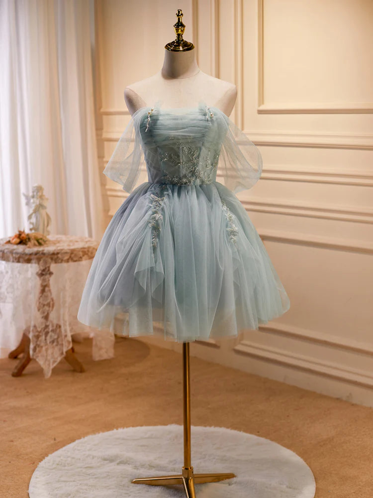 Side view of the light green tulle beaded homecoming dress.