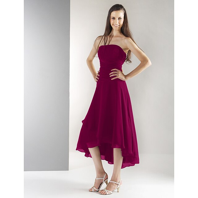 Back view of the tea-length bridesmaid dress showing an open back.