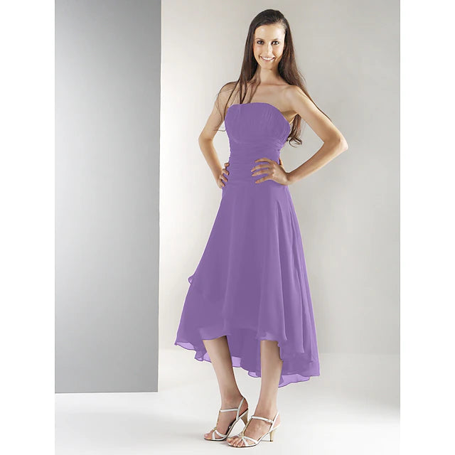 Side profile of a strapless chiffon dress with asymmetrical draping.
