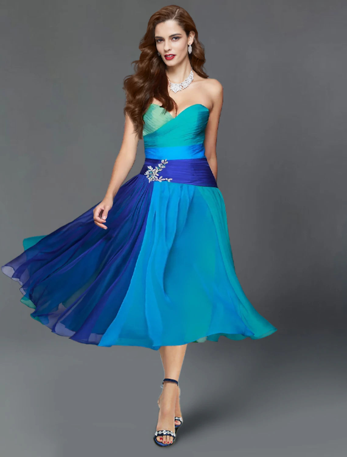 Elegant A-Line strapless color block tea length dress with ruched details.