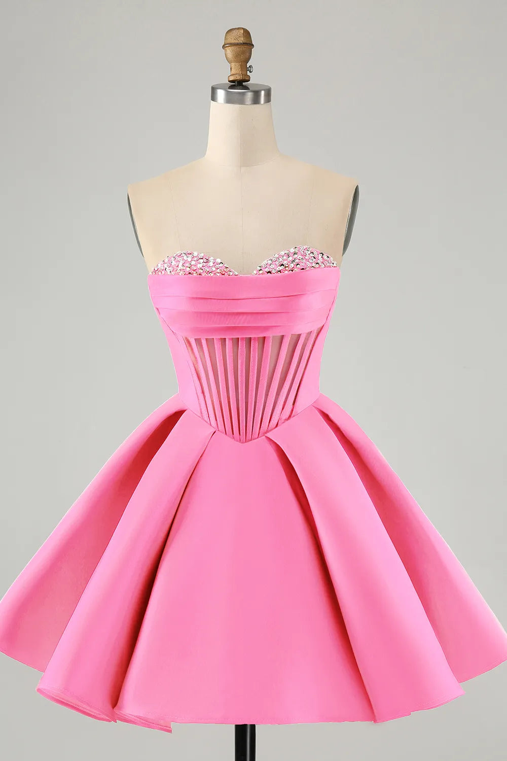 Pink A-line strapless satin corset short homecoming dress with beading.