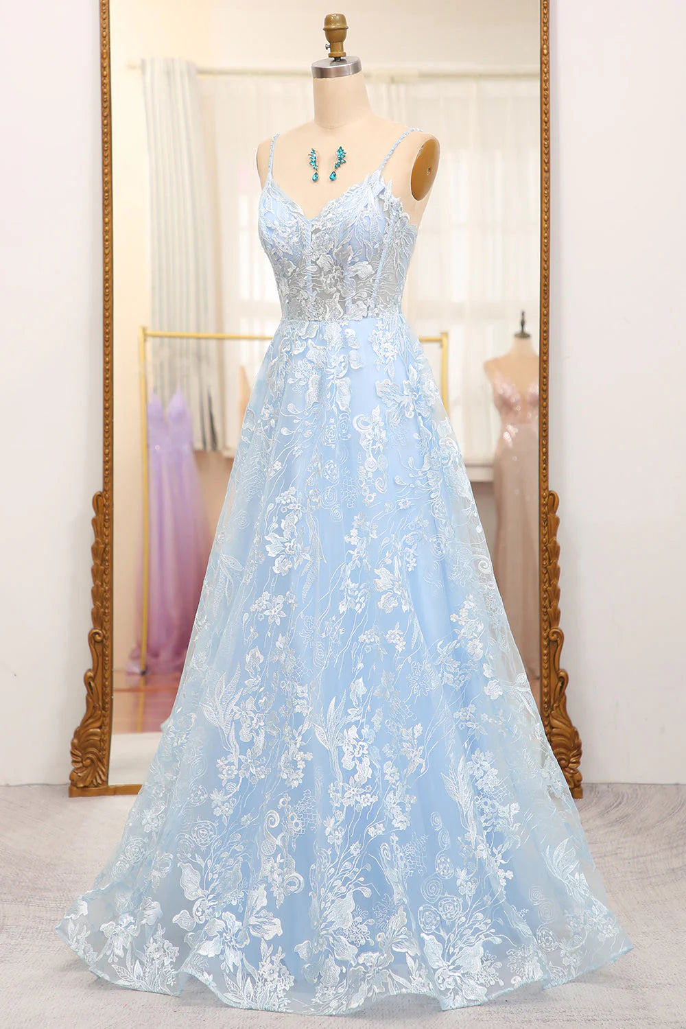Side view of the sky blue A-line tulle prom dress, highlighting the flowing skirt.