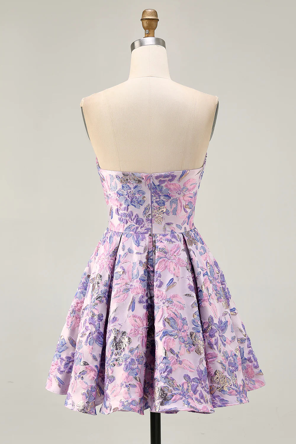 Close-up of floral jacquard fabric on lavender dress.