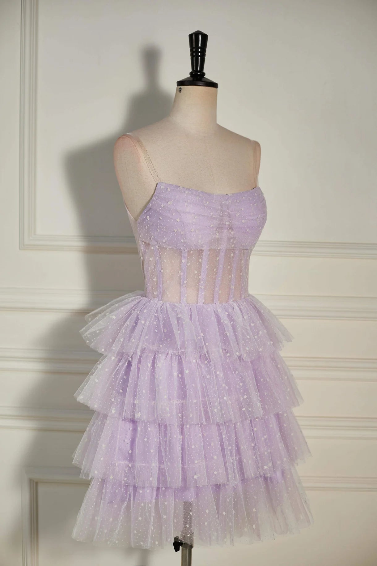 Back view of a strapless A-line homecoming dress with flowing tulle.