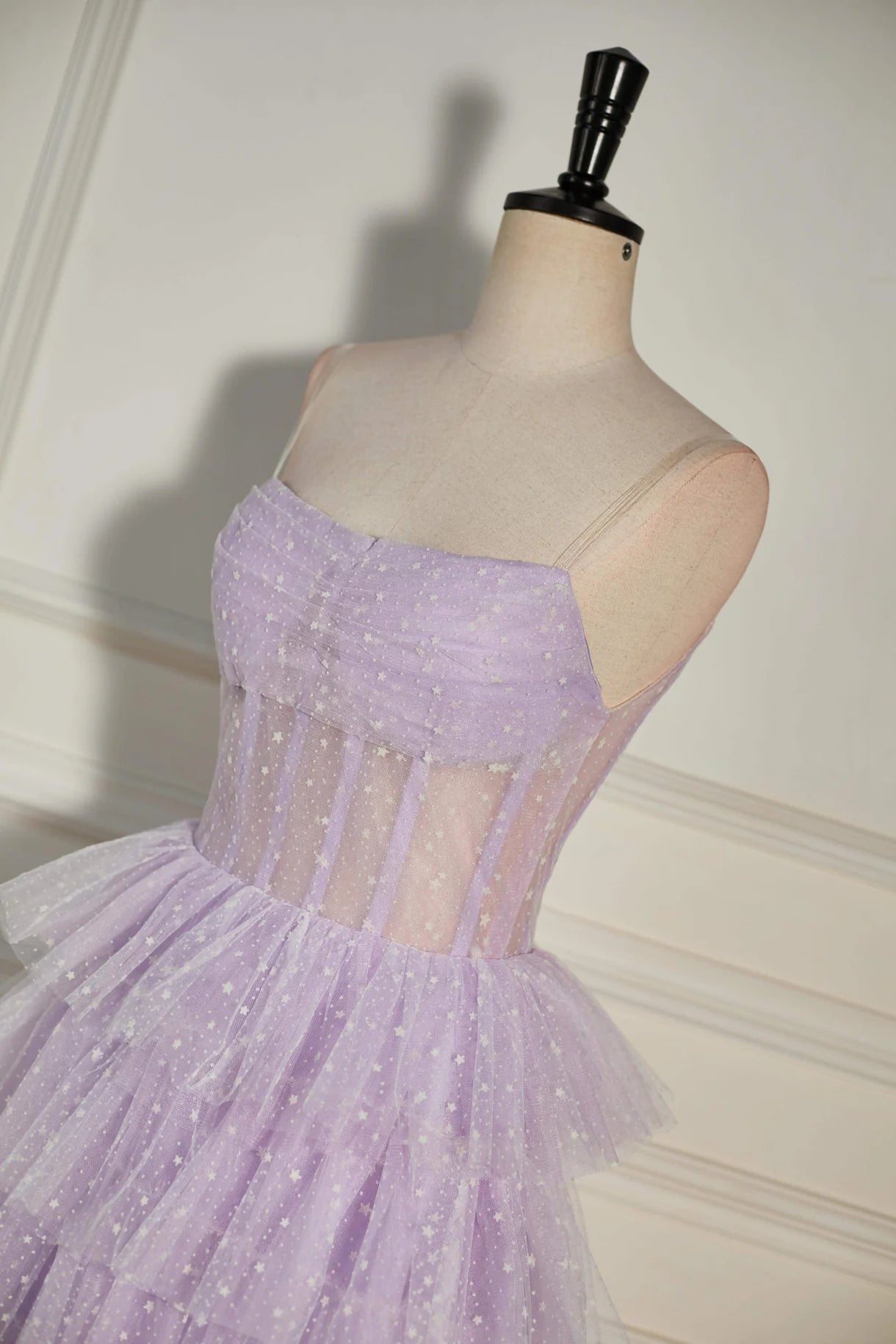 Full view of the strapless homecoming dress with a playful, layered skirt.