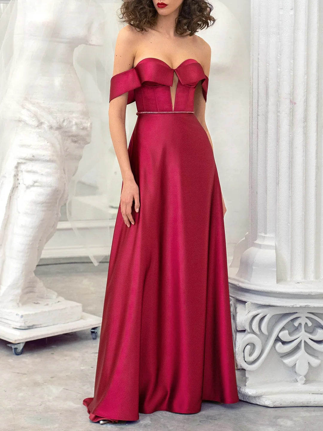 Elegant A-line strapless floor-length evening gown on a model.