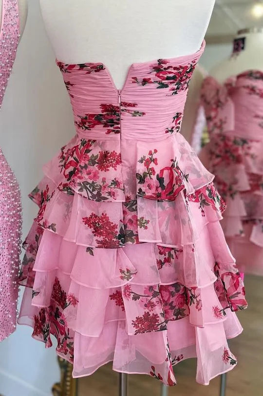 Back view of pink A-line strapless floral layered dress.