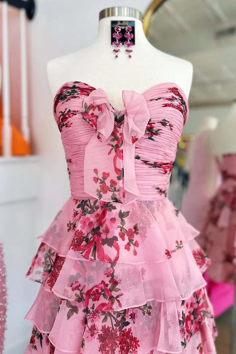 Side view of pink A-line strapless floral short dress.