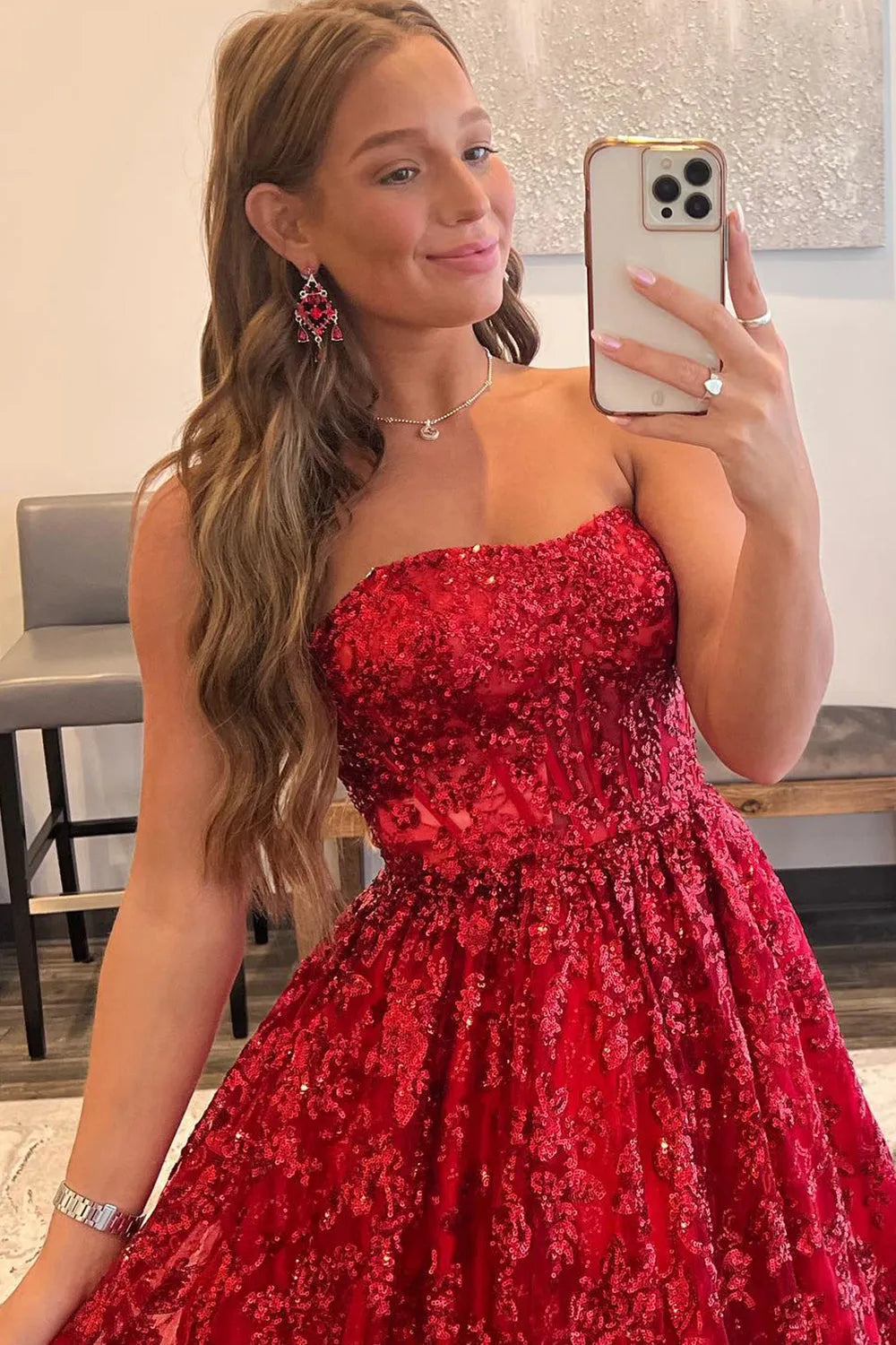 Close-up of the strapless bodice of the red prom dress.