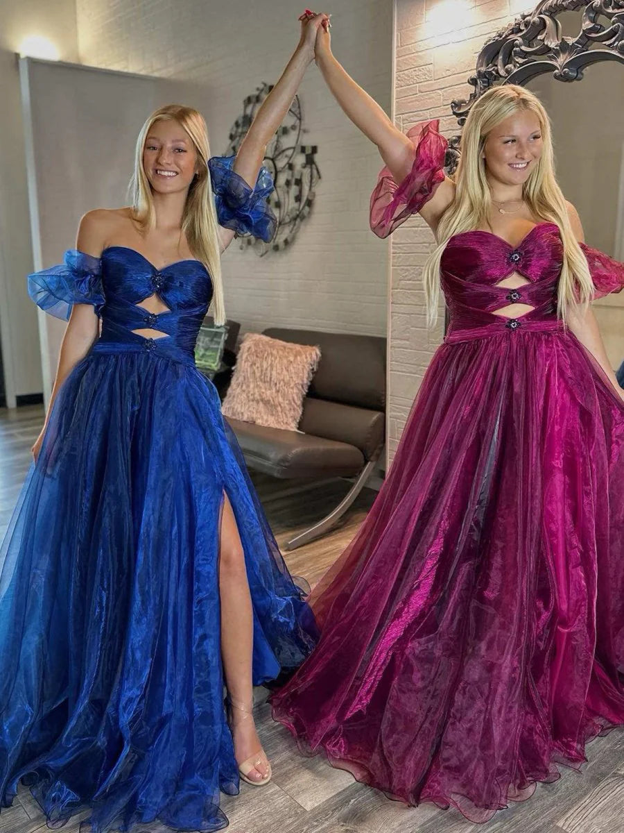 Side view of the royal blue strapless prom dress, showcasing the balloon sleeves.