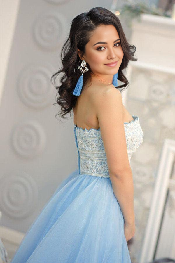 Back view of light blue A-line strapless prom dress with intricate lace.