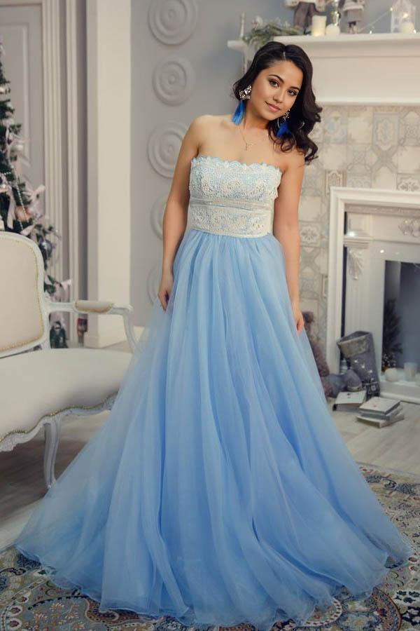 Close-up of beading and lace details on a light blue prom dress.