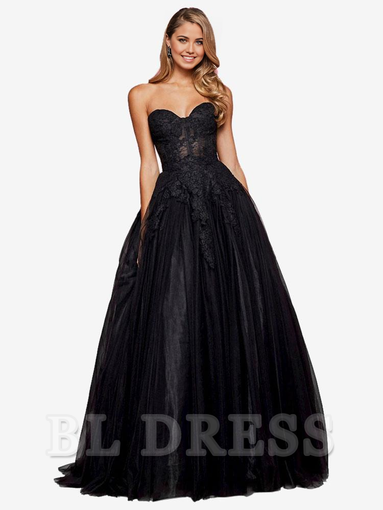 Model posing in a sophisticated A-line strapless lace evening gown.