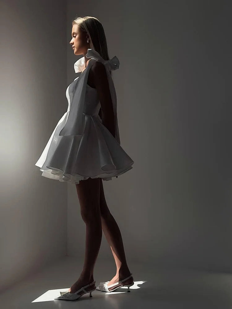 Side view of a short A-line dress, showing the elegant silhouette.