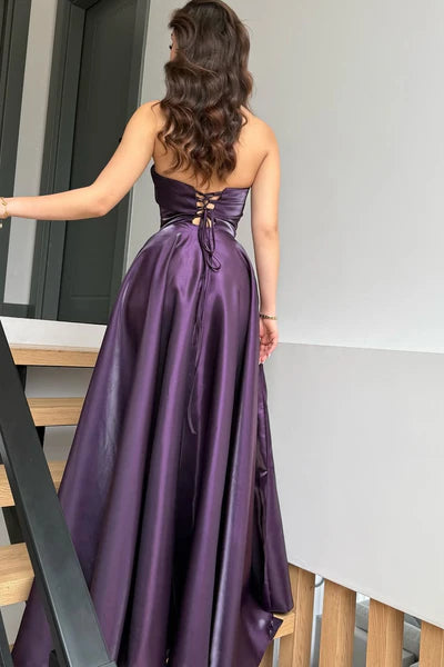 Back view of purple prom dress showing lace-up detail.