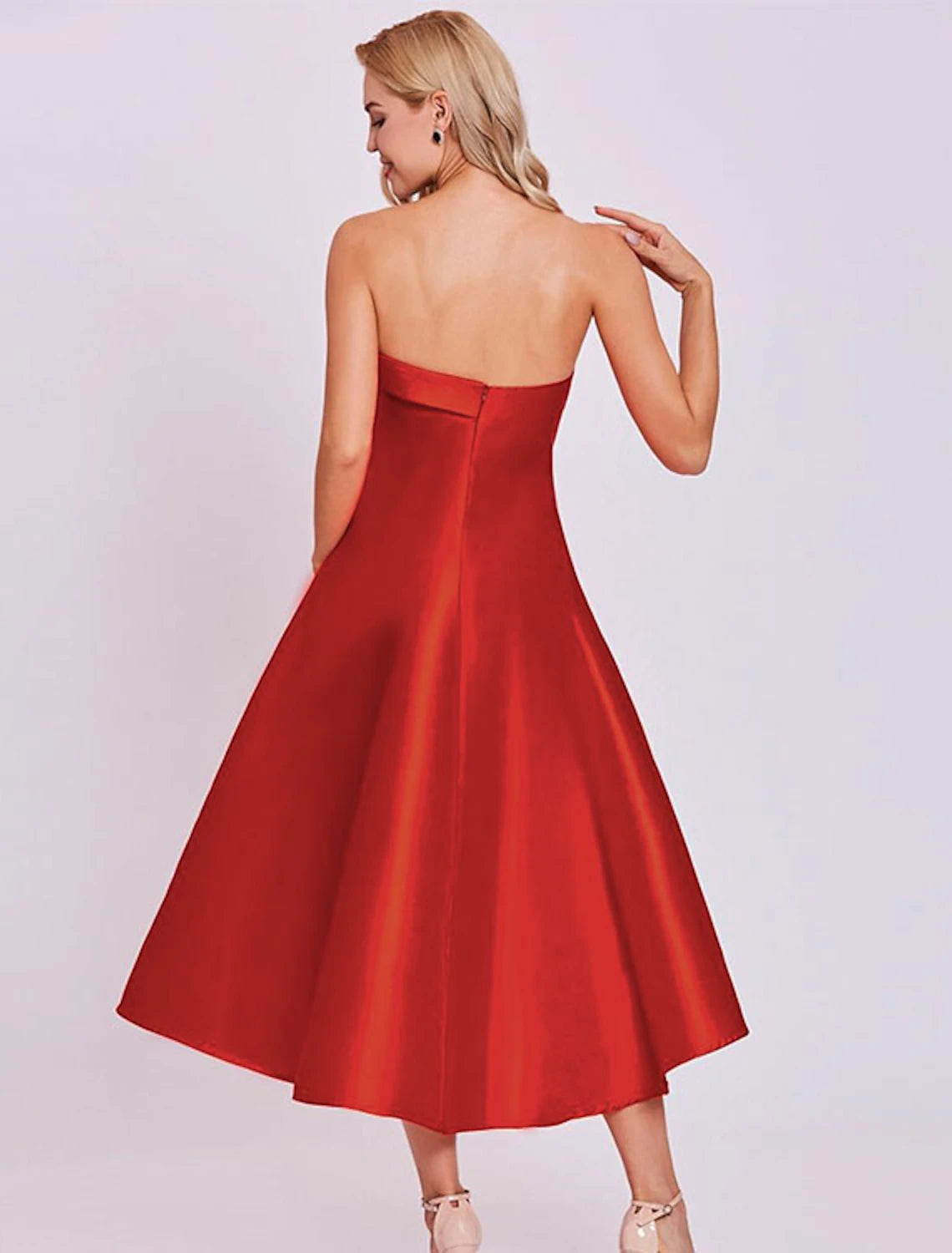 Back view of a minimalist tea-length satin dress.