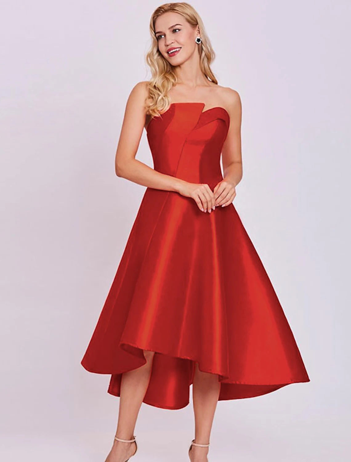 Model showcasing the sophisticated silhouette of the strapless satin dress.