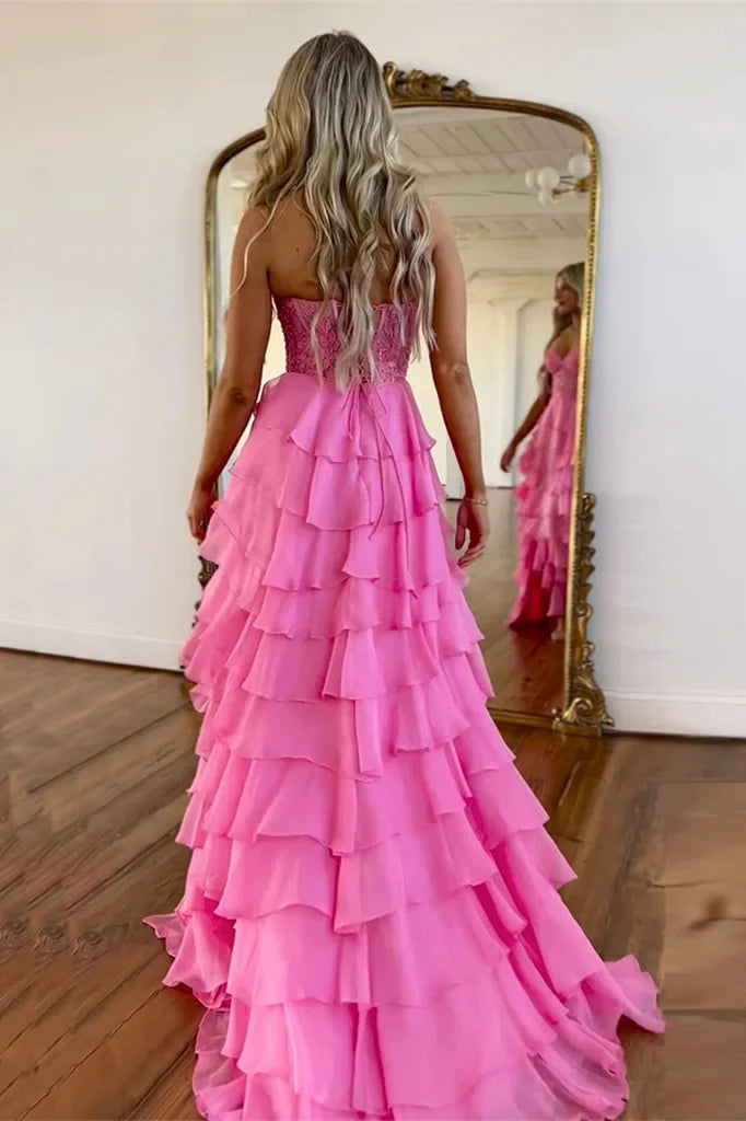 Close-up of the pink strapless A-line chiffon prom dress with ruffle tiers.