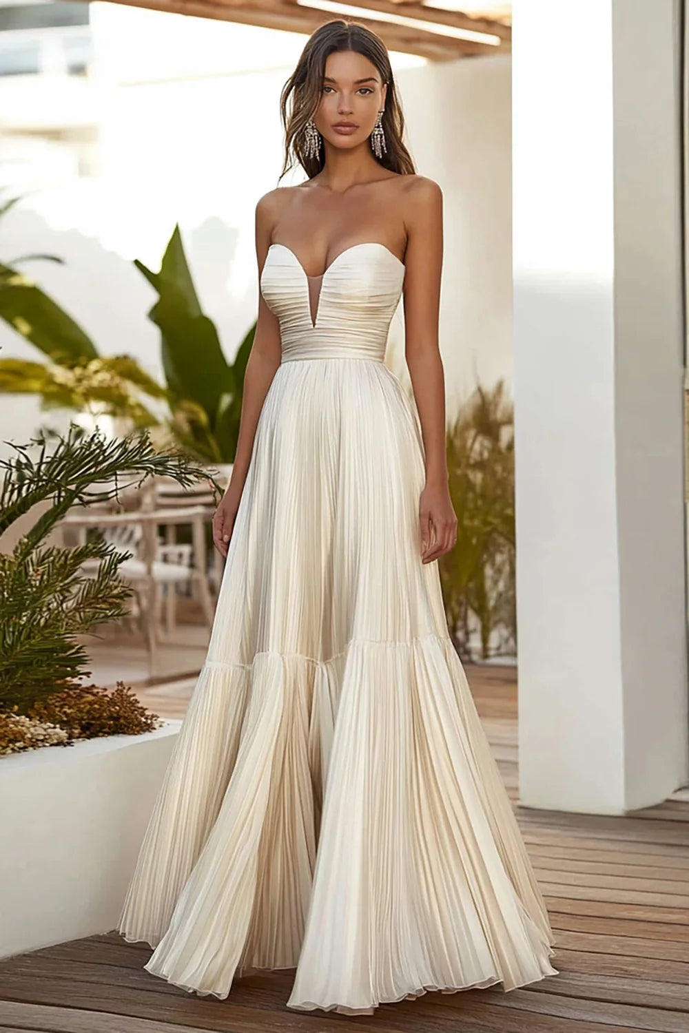 Elegant A-line strapless pleated long prom dress on a model.