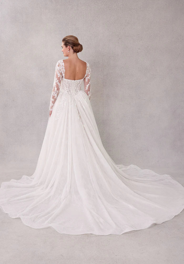 Back view of a bride wearing the white pleated tulle wedding gown.