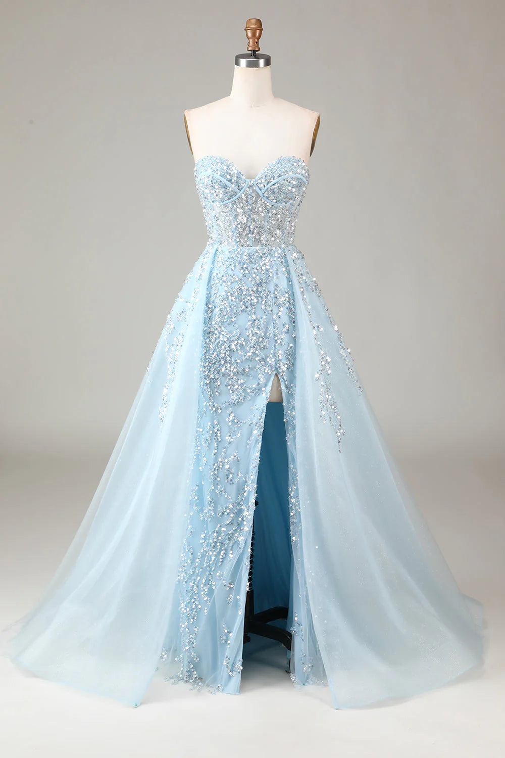 Light blue A-line strapless prom dress with a high slit.