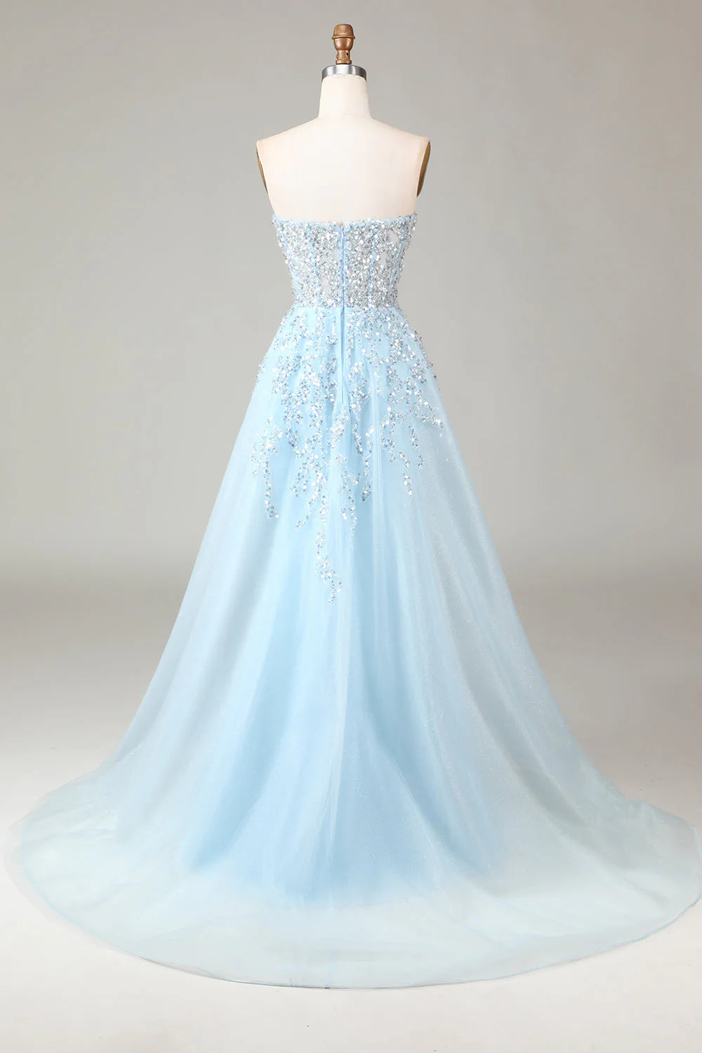 Side view of the light blue strapless A-line gown.