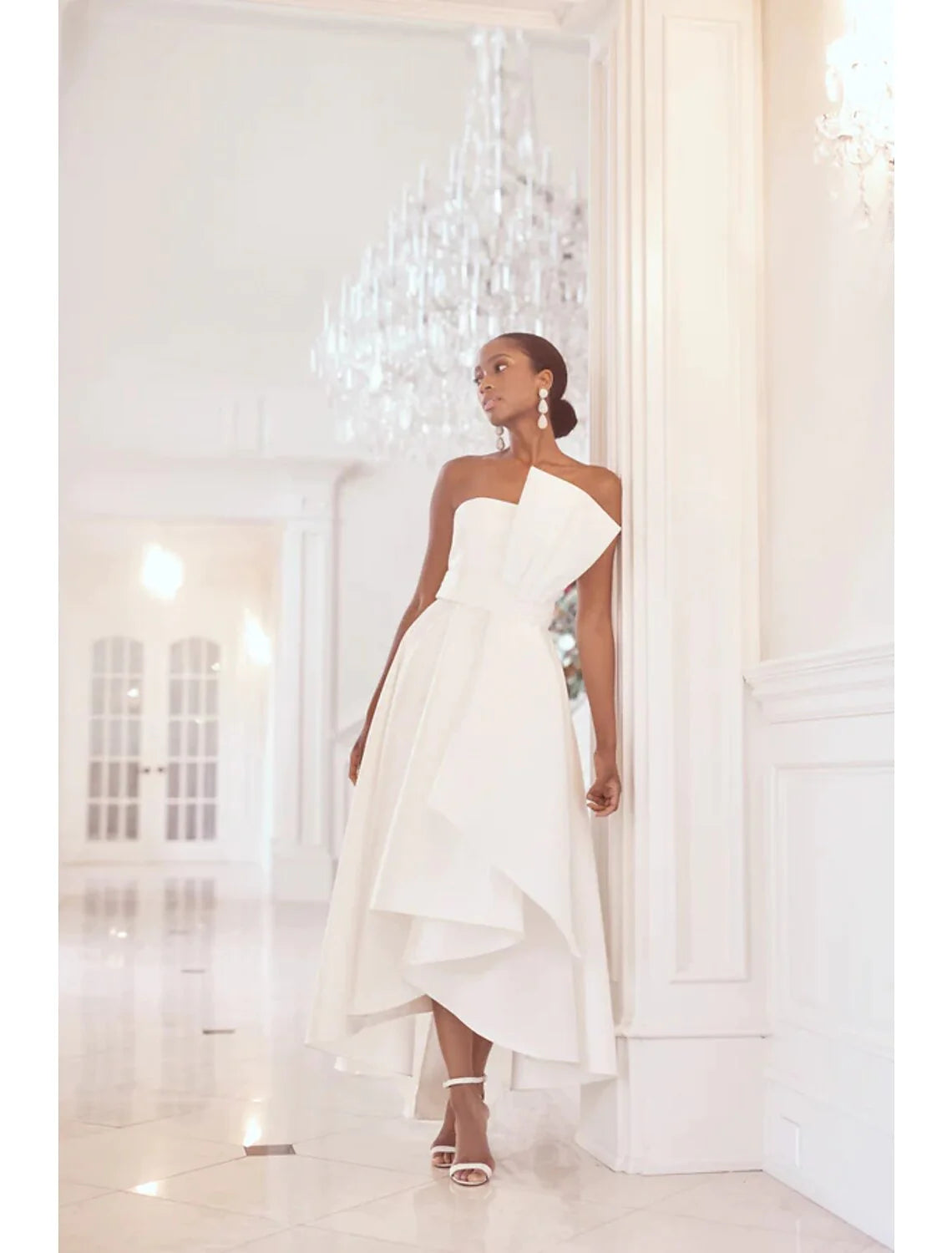Elegant A-line strapless taffeta prom dress with ruched detailing.